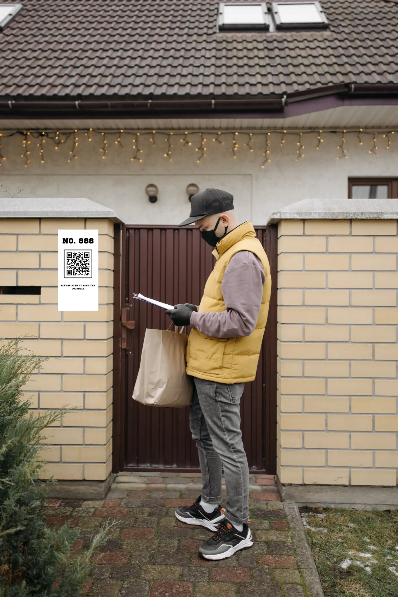 QR bell, delivery man in yellow vest, brown paper bag, fence